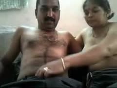 A big, ugly Indian man with a mustache plays with his wife's pointer sisters.